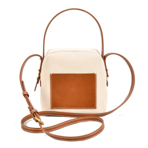 GeleiStory/GeleiStory  牛皮手提斜跨帆布包2021新款时尚包包女简约大气手提包