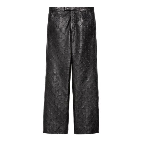  GUCCI古驰 22年秋冬 男士 GG皮革长裤 669071 XNAPN 1000